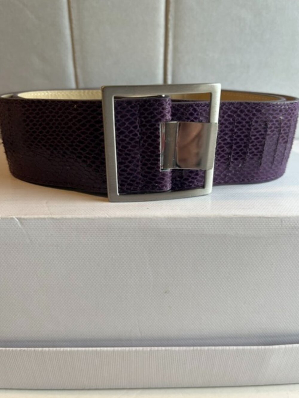 Purple textured leather belt.